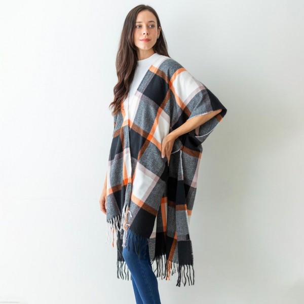 Women's Black Plaid Knit Ruana Wrap Featuring Tassel Edges.

- One Size Fits Most (Sizes 0-14)
- Approximately 32" in Length
- 100% Polyester
