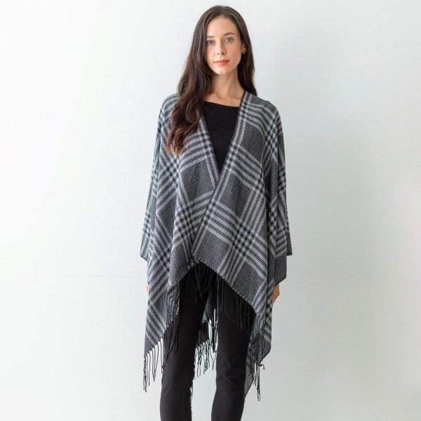 Women's Black Plaid Knit Ruana Wrap Featuring Tassel Edges.

- One Size Fits Most ( Sizes 0-14)
- Approximately 32" in Length
- 100% Polyester