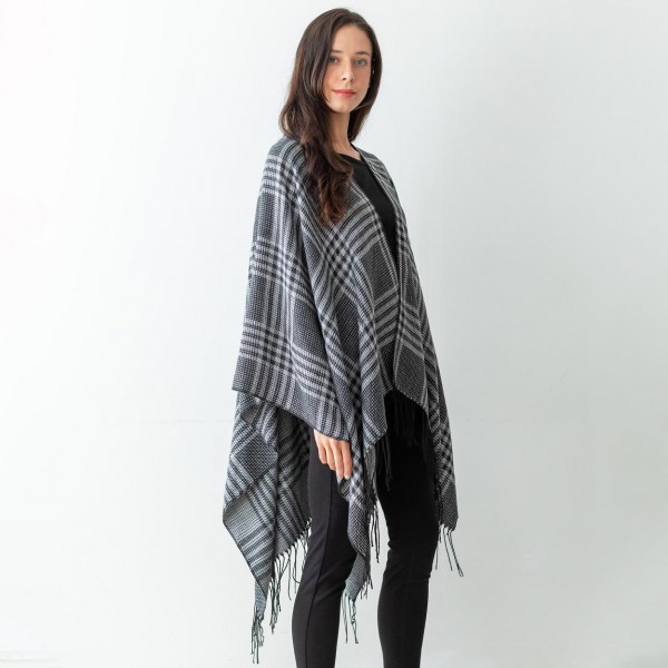 Women's Black Plaid Knit Ruana Wrap Featuring Tassel Edges.

- One Size Fits Most ( Sizes 0-14)
- Approximately 32" in Length
- 100% Polyester