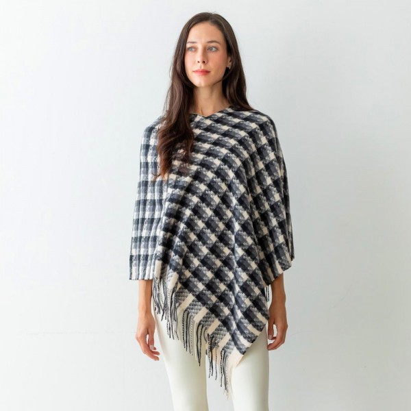 Women's Checkered Plaid Knit Poncho Featuring Tassel Edges.

- One Size Fits Most (Sizes 0-14)
- Approximately 40" in Length
- 100% Polyester