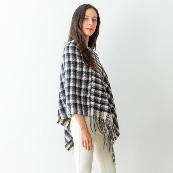 Women's Checkered Plaid Knit Poncho Featuring Tassel Edges.

- One Size Fits Most (Sizes 0-14)
- Approximately 40" in Length
- 100% Polyester