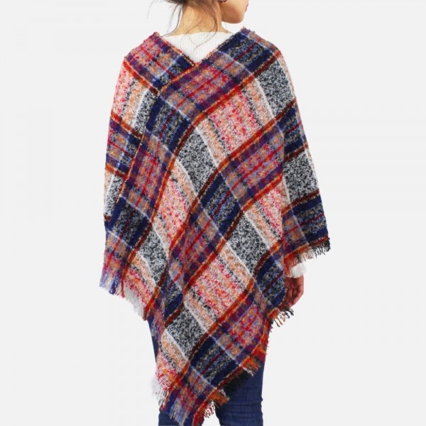 Plaid poncho featuring frayed edges
-One size fits most 0-14
-100% Polyester