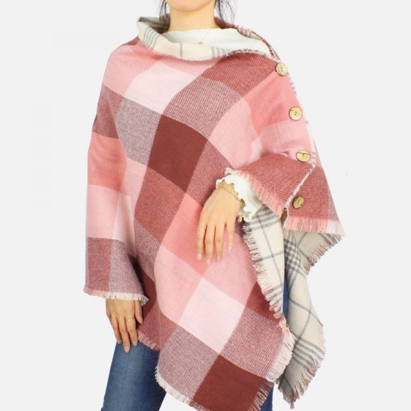 Reversible Plaid Poncho featuring button details and frayed edges
-One size fits most 0-14
-100% Acrylic