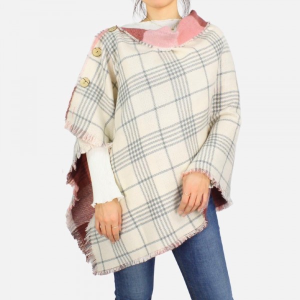Reversible Plaid Poncho featuring button details and frayed edges
-One size fits most 0-14
-100% Acrylic