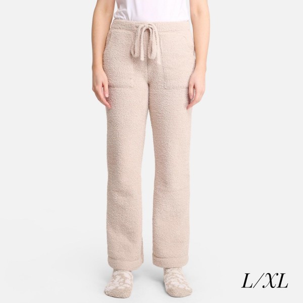 Women's Wide Leg Drawstring Lounge Pants

• Size: L/XL (Sizes 10-14)
• Approximately 42" in Length
• 30" Inseam
• 100% Polyester
• Drawstring high-rise waistband
• Two pockets for keeping your hands warm
• Wide leg silhouette
• Soft and comfortable fabric with stretch
• Comfortable, relaxed fit
• Flare hem
• Style with your favorite tee for a laid-back look
• Soft and stretchy
• Comfortable for lounging at home
