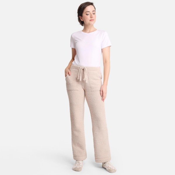 Women's Wide Leg Drawstring Lounge Pants

• Size: L/XL (Sizes 10-14)
• Approximately 42" in Length
• 30" Inseam
• 100% Polyester
• Drawstring high-rise waistband
• Two pockets for keeping your hands warm
• Wide leg silhouette
• Soft and comfortable fabric with stretch
• Comfortable, relaxed fit
• Flare hem
• Style with your favorite tee for a laid-back look
• Soft and stretchy
• Comfortable for lounging at home