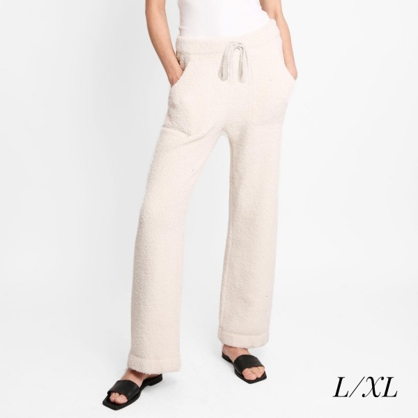 Women's Wide Leg Drawstring Lounge Pants

• Size: L/XL (Sizes 10-14)
• Approximately 42" in Length
• 30" Inseam
• 100% Polyester
• Drawstring high-rise waistband
• Two pockets for keeping your hands warm
• Wide leg silhouette
• Soft and comfortable fabric with stretch
• Comfortable, relaxed fit
• Flare hem
• Style with your favorite tee for a laid-back look
• Soft and stretchy
• Comfortable for lounging at home