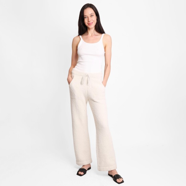 Women's Wide Leg Drawstring Lounge Pants

• Size: L/XL (Sizes 10-14)
• Approximately 42" in Length
• 30" Inseam
• 100% Polyester
• Drawstring high-rise waistband
• Two pockets for keeping your hands warm
• Wide leg silhouette
• Soft and comfortable fabric with stretch
• Comfortable, relaxed fit
• Flare hem
• Style with your favorite tee for a laid-back look
• Soft and stretchy
• Comfortable for lounging at home