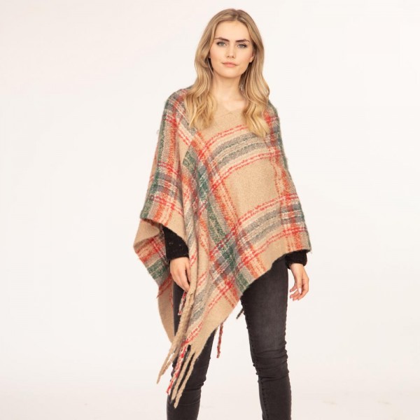 Women's Plaid Knit Poncho Featuring Tassel Edges.

- One Size Fits Most (Sizes 0-14)
- Approximately 39" in Length
- 100% Polyester