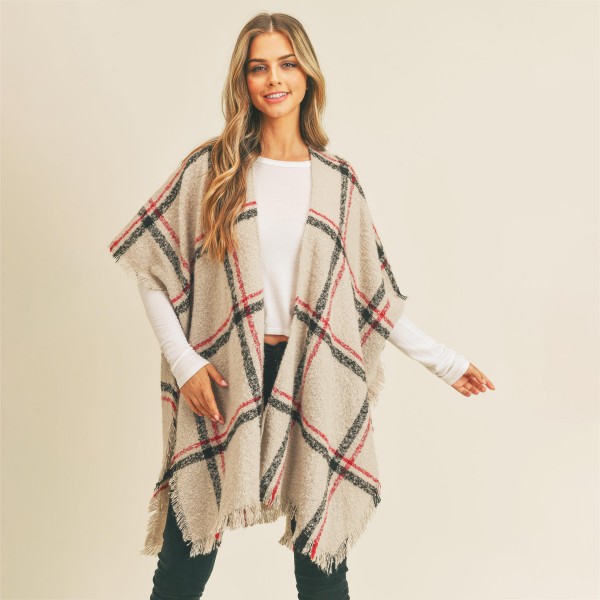 Plaid knit kimono

-One size fits most 0-14
-100% Polyester