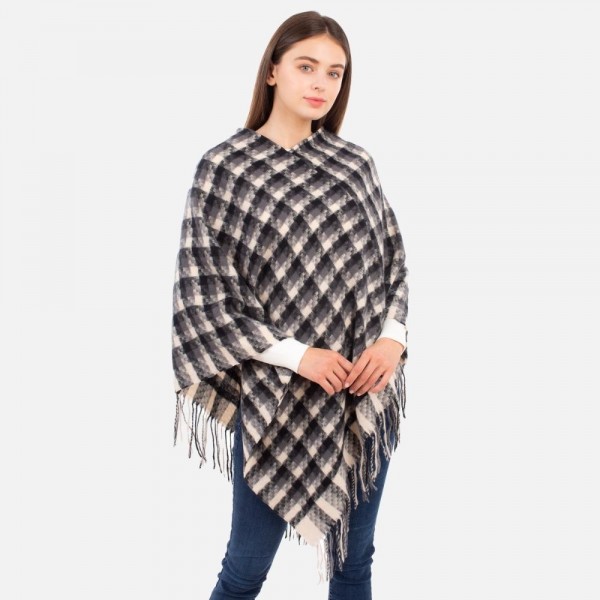 Women's Plaid Knit Poncho Featuring Fringe Accents.

- One Size Fits Most (Sizes 0-14)
- 100% Polyester