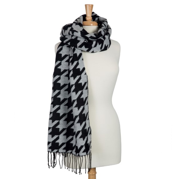 Black and white heavyweight houndstooth printed scarf with fringe. Can be worn as a shawl. 80% Acrylic and 20% polyester. Approximately 27" x 71".