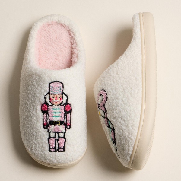 Fuzzy Holiday Slippers with Nutcracker and Ribbon Ornament (6-Pack) 

- Rubber Sole 
- Non-Slip
- 100% Polyester 