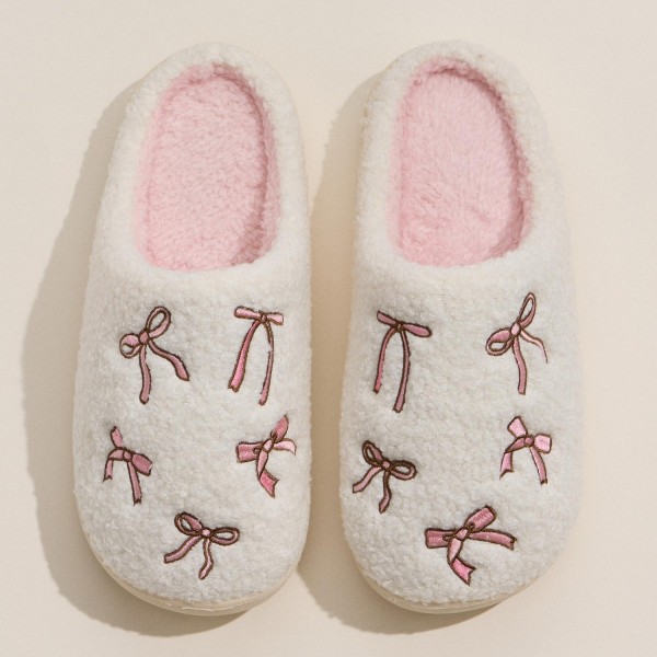 Cozy Bow Embroidered Plush Slippers (6-Pack) 

- Rubber Sole 
- Non-Slip 
- 100% Polyester 