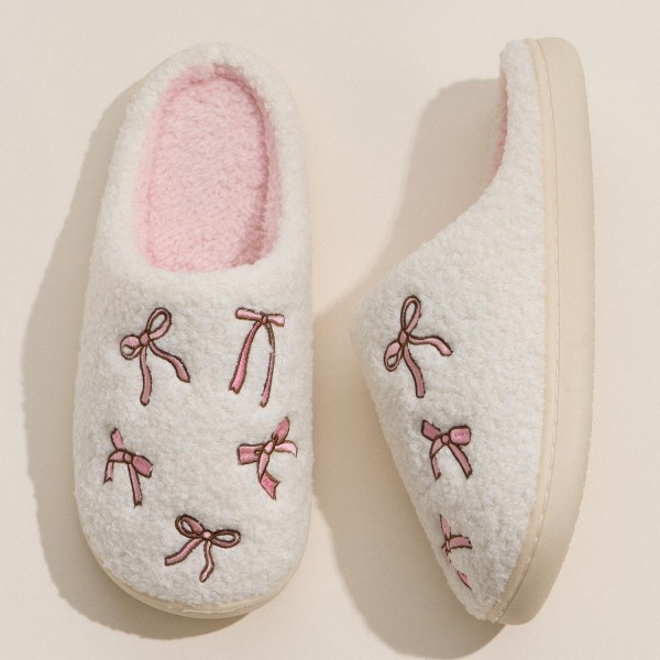 Cozy Bow Embroidered Plush Slippers (6-Pack) 

- Rubber Sole 
- Non-Slip 
- 100% Polyester 