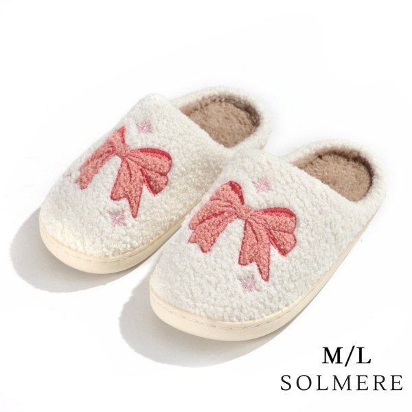 SOLMERE Slippers – Plush Bow Slide On Slippers

Step into pure indulgence. Our Solmere Slippers blend a trend-forward design with cloud-like comfort, making every step feel like a warm embrace.

- Incredible Comfort – Lined with ultra-soft, plush material to keep your feet cozy from morning to night.

- Slip-On Ease – Effortless to wear, with a secure yet relaxed fit.

- Durable & Lightweight – Crafted for everyday wear with a cushioned sole that supports and lasts.

- US Women's Size: S/M (6-8) M/L (8-10)

- Rubber Sole - Provides grip and stability for both indoor and light outdoor use.

- Thoughtful Packaging – Each pair comes neatly displayed on a branded slipper hanger with a branded card, and individually packaged.

Once you slip them on, you’ll understand why SOLMERE slippers are love at first step.