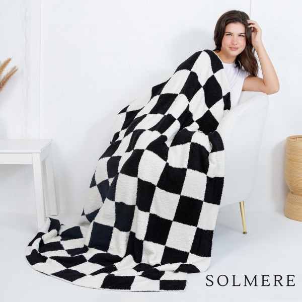 Solmere Blanket – Checkered Print Blanket

Wrap yourself in pure indulgence. Our Solmere Blanket combines a fashion-forward design with an irresistibly soft hand-feel that’s as beautiful as it is cozy.

- Luxuriously Soft – Crafted from ultra-plush, high-quality fibers you’ll want to snuggle into all season long.

- Perfectly Sized – Approximately 50” W x 60” L, perfect for draping over your sofa, bed, or yourself.

- Premium Craftsmanship – 100% polyester for lasting softness, warmth, and easy care.

- Thoughtful Packaging – Each blanket is tied with a branded ribbon in a bow and includes two cards: one featuring the SOLMERE brand and another showcasing a high-quality image of the blanket’s print. Individually packaged

Once you touch it, you’ll understand why SOLMERE blankets are love at first feel.
