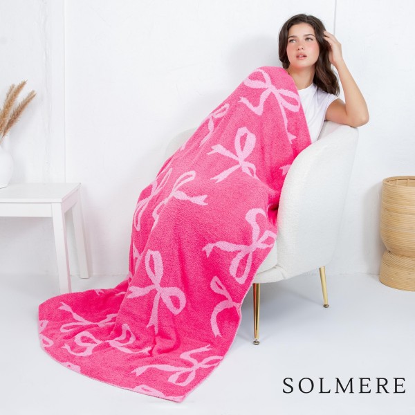 Solmere Blanket – All Over Bows Blanket

Wrap yourself in pure indulgence. Our Solmere Blanket combines a fashion-forward design with an irresistibly soft hand-feel that’s as beautiful as it is cozy.

- Luxuriously Soft – Crafted from ultra-plush, high-quality fibers you’ll want to snuggle into all season long.

- Perfectly Sized – Approximately 50” W x 60” L, perfect for draping over your sofa, bed, or yourself.

- Premium Craftsmanship – 100% polyester for lasting softness, warmth, and easy care.

- Thoughtful Packaging – Each blanket is tied with a branded ribbon in a bow and includes two cards: one featuring the SOLMERE brand and another showcasing a high-quality image of the blanket’s print. Individually packaged

Once you touch it, you’ll understand why SOLMERE blankets are love at first feel.
 