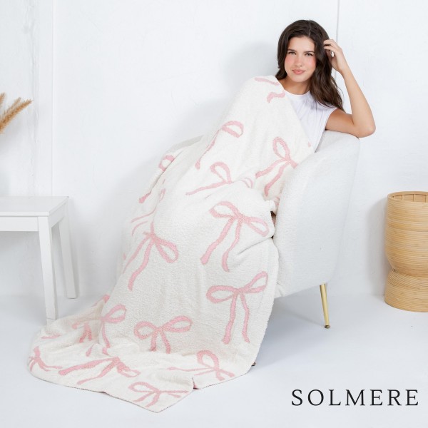 Solmere Blanket – Elegant Bow Print Blanket

Wrap yourself in pure indulgence. Our Solmere Blanket combines a fashion-forward design with an irresistibly soft hand-feel that’s as beautiful as it is cozy.

- Luxuriously Soft – Crafted from ultra-plush, high-quality fibers you’ll want to snuggle into all season long.

- Perfectly Sized – Approximately 50” W x 60” L, perfect for draping over your sofa, bed, or yourself.

- Premium Craftsmanship – 100% polyester for lasting softness, warmth, and easy care.

- Thoughtful Packaging – Each blanket is tied with a branded ribbon in a bow and includes two cards: one featuring the SOLMERE brand and another showcasing a high-quality image of the blanket’s print. Individually packaged

Once you touch it, you’ll understand why SOLMERE blankets are love at first feel.
