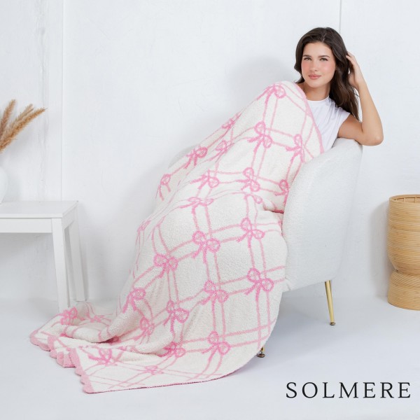 Solmere Blanket – Gridded Bows Blanket

Wrap yourself in pure indulgence. Our Solmere Blanket combines a fashion-forward design with an irresistibly soft hand-feel that’s as beautiful as it is cozy.

- Luxuriously Soft – Crafted from ultra-plush, high-quality fibers you’ll want to snuggle into all season long.

- Perfectly Sized – Approximately 50” W x 60” L, perfect for draping over your sofa, bed, or yourself.

- Premium Craftsmanship – 100% polyester for lasting softness, warmth, and easy care.

- Thoughtful Packaging – Each blanket is tied with a branded ribbon in a bow and includes two cards: one featuring the SOLMERE brand and another showcasing a high-quality image of the blanket’s print. Individually packaged

Once you touch it, you’ll understand why SOLMERE blankets are love at first feel.
