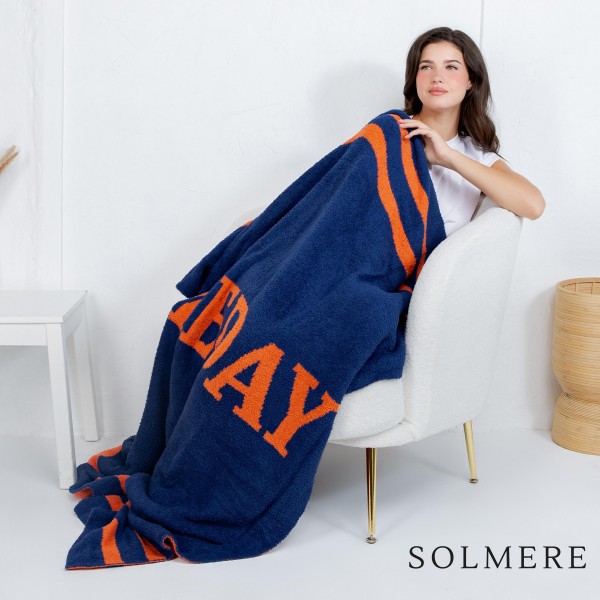 Solmere Blanket – Game Day Blanket

Wrap yourself in pure indulgence. Our Solmere Blanket combines a fashion-forward design with an irresistibly soft hand-feel that’s as beautiful as it is cozy.

- Luxuriously Soft – Crafted from ultra-plush, high-quality fibers you’ll want to snuggle into all season long.

- Perfectly Sized – Approximately 50” W x 60” L, perfect for draping over your sofa, bed, or yourself.

- Premium Craftsmanship – 100% polyester for lasting softness, warmth, and easy care.

- Thoughtful Packaging – Each blanket is tied with a branded ribbon in a bow and includes two cards: one featuring the SOLMERE brand and another showcasing a high-quality image of the blanket’s print. Individually packaged

Once you touch it, you’ll understand why SOLMERE blankets are love at first feel.
