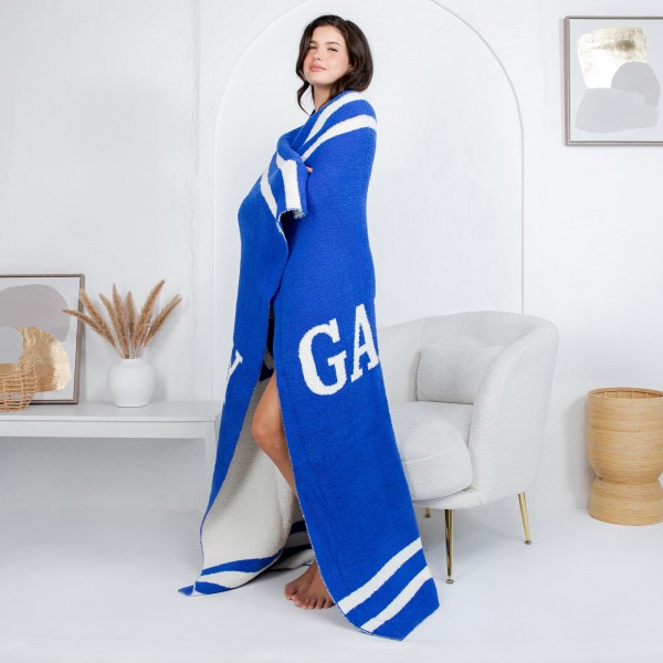 Solmere Blanket – Game Day Blanket
Wrap yourself in pure indulgence. Our Solmere Blanket combines a fashion-forward design with an irresistibly soft hand-feel that’s as beautiful as it is cozy.
- Luxuriously Soft – Crafted from ultra-plush, high-quality fibers you’ll want to snuggle into all season long.
- Perfectly Sized – Approximately 50” W x 60” L, perfect for draping over your sofa, bed, or yourself.
- Premium Craftsmanship – 100% polyester for lasting softness, warmth, and easy care.
- Thoughtful Packaging – Each blanket is tied with a branded ribbon in a bow and includes two cards: one featuring the SOLMERE brand and another showcasing a high-quality image of the blanket’s print. Individually packaged
Once you touch it, you’ll understand why SOLMERE blankets are love at first feel.