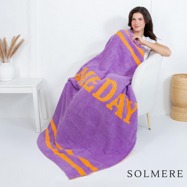 Solmere Blanket – Game Day Blanket

Wrap yourself in pure indulgence. Our Solmere Blanket combines a fashion-forward design with an irresistibly soft hand-feel that’s as beautiful as it is cozy.

- Luxuriously Soft – Crafted from ultra-plush, high-quality fibers you’ll want to snuggle into all season long.

- Perfectly Sized – Approximately 50” W x 60” L, perfect for draping over your sofa, bed, or yourself.

- Premium Craftsmanship – 100% polyester for lasting softness, warmth, and easy care.

- Thoughtful Packaging – Each blanket is tied with a branded ribbon in a bow and includes two cards: one featuring the SOLMERE brand and another showcasing a high-quality image of the blanket’s print. Individually packaged

Once you touch it, you’ll understand why SOLMERE blankets are love at first feel.
