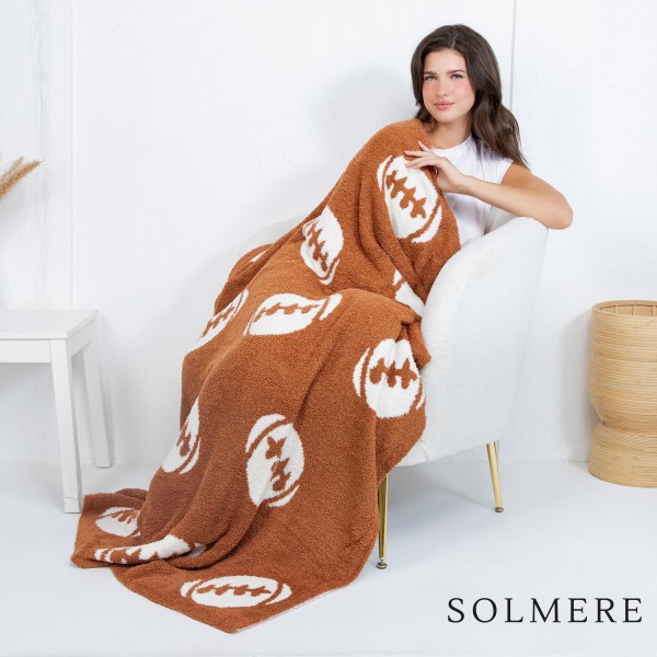 Solmere Blanket – Sports Ball Print Blanket

Wrap yourself in pure indulgence. Our Solmere Blanket combines a fashion-forward design with an irresistibly soft hand-feel that’s as beautiful as it is cozy.

- Luxuriously Soft – Crafted from ultra-plush, high-quality fibers you’ll want to snuggle into all season long.

- Perfectly Sized – Approximately 50” W x 60” L, perfect for draping over your sofa, bed, or yourself.

- Premium Craftsmanship – 100% polyester for lasting softness, warmth, and easy care.

- Thoughtful Packaging – Each blanket is tied with a branded ribbon in a bow and includes two cards: one featuring the SOLMERE brand and another showcasing a high-quality image of the blanket’s print. Individually packaged

Once you touch it, you’ll understand why SOLMERE blankets are love at first feel.
