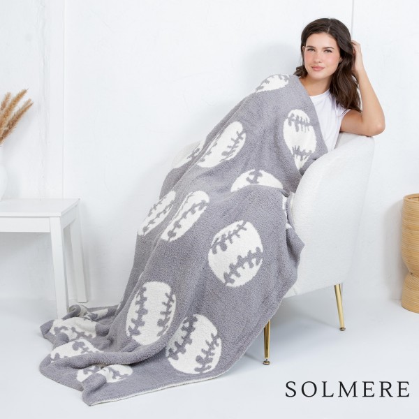 Solmere Blanket – Sports Ball Print Blanket

Wrap yourself in pure indulgence. Our Solmere Blanket combines a fashion-forward design with an irresistibly soft hand-feel that’s as beautiful as it is cozy.

- Luxuriously Soft – Crafted from ultra-plush, high-quality fibers you’ll want to snuggle into all season long.

- Perfectly Sized – Approximately 50” W x 60” L, perfect for draping over your sofa, bed, or yourself.

- Premium Craftsmanship – 100% polyester for lasting softness, warmth, and easy care.

- Thoughtful Packaging – Each blanket is tied with a branded ribbon in a bow and includes two cards: one featuring the SOLMERE brand and another showcasing a high-quality image of the blanket’s print. Individually packaged

Once you touch it, you’ll understand why SOLMERE blankets are love at first feel.

