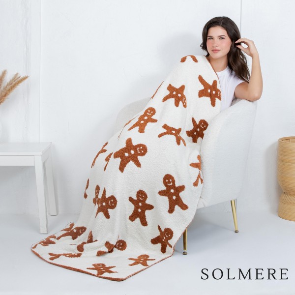 Solmere Blanket – Gingerbread Blanket

Wrap yourself in pure indulgence. Our Solmere Blanket combines a fashion-forward design with an irresistibly soft hand-feel that’s as beautiful as it is cozy.

- Luxuriously Soft – Crafted from ultra-plush, high-quality fibers you’ll want to snuggle into all season long.

- Perfectly Sized – Approximately 50” W x 60” L, perfect for draping over your sofa, bed, or yourself.

- Premium Craftsmanship – 100% polyester for lasting softness, warmth, and easy care.

- Thoughtful Packaging – Each blanket is tied with a branded ribbon in a bow and includes two cards: one featuring the SOLMERE brand and another showcasing a high-quality image of the blanket’s print. Individually packaged

Once you touch it, you’ll understand why SOLMERE blankets are love at first feel.

