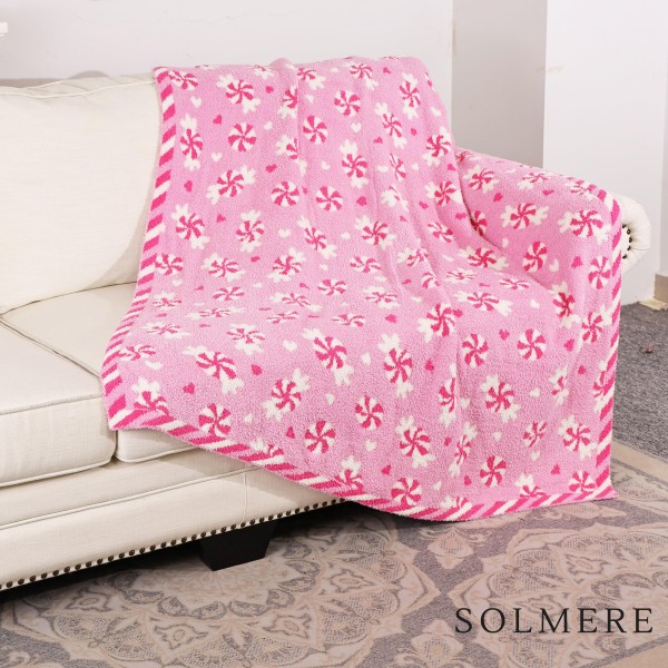Solmere Blanket – Pink Swirl Candy Blanket

Wrap yourself in pure indulgence. Our Solmere Blanket combines a fashion-forward design with an irresistibly soft hand-feel that’s as beautiful as it is cozy.

- Luxuriously Soft – Crafted from ultra-plush, high-quality fibers you’ll want to snuggle into all season long.

- Perfectly Sized – Approximately 50” W x 60” L, perfect for draping over your sofa, bed, or yourself.

- Premium Craftsmanship – 100% polyester for lasting softness, warmth, and easy care.

- Thoughtful Packaging – Each blanket is tied with a branded ribbon in a bow and includes two cards: one featuring the SOLMERE brand and another showcasing a high-quality image of the blanket’s print. Individually packaged

Once you touch it, you’ll understand why SOLMERE blankets are love at first feel.

