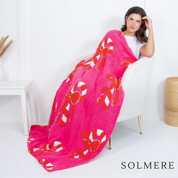 Solmere Blanket – Christmas Candy Cane Bow Blanket

Wrap yourself in pure indulgence. Our Solmere Blanket combines a fashion-forward design with an irresistibly soft hand-feel that’s as beautiful as it is cozy.

- Luxuriously Soft – Crafted from ultra-plush, high-quality fibers you’ll want to snuggle into all season long.

- Perfectly Sized – Approximately 50” W x 60” L, perfect for draping over your sofa, bed, or yourself.

- Premium Craftsmanship – 100% polyester for lasting softness, warmth, and easy care.

- Thoughtful Packaging – Each blanket is tied with a branded ribbon in a bow and includes two cards: one featuring the SOLMERE brand and another showcasing a high-quality image of the blanket’s print. Individually packaged

Once you touch it, you’ll understand why SOLMERE blankets are love at first feel.
