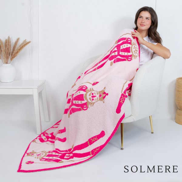 Solmere Blanket – Pink Nutcracker Blanket

Wrap yourself in pure indulgence. Our Solmere Blanket combines a fashion-forward design with an irresistibly soft hand-feel that’s as beautiful as it is cozy.

- Luxuriously Soft – Crafted from ultra-plush, high-quality fibers you’ll want to snuggle into all season long.

- Perfectly Sized – Approximately 50” W x 60” L, perfect for draping over your sofa, bed, or yourself.

- Premium Craftsmanship – 100% polyester for lasting softness, warmth, and easy care.

- Thoughtful Packaging – Each blanket is tied with a branded ribbon in a bow and includes two cards: one featuring the SOLMERE brand and another showcasing a high-quality image of the blanket’s print. Individually packaged

Once you touch it, you’ll understand why SOLMERE blankets are love at first feel.

