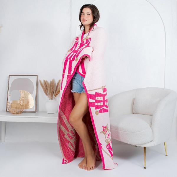 Solmere Blanket – Pink Nutcracker Blanket

Wrap yourself in pure indulgence. Our Solmere Blanket combines a fashion-forward design with an irresistibly soft hand-feel that’s as beautiful as it is cozy.

- Luxuriously Soft – Crafted from ultra-plush, high-quality fibers you’ll want to snuggle into all season long.

- Perfectly Sized – Approximately 50” W x 60” L, perfect for draping over your sofa, bed, or yourself.

- Premium Craftsmanship – 100% polyester for lasting softness, warmth, and easy care.

- Thoughtful Packaging – Each blanket is tied with a branded ribbon in a bow and includes two cards: one featuring the SOLMERE brand and another showcasing a high-quality image of the blanket’s print. Individually packaged

Once you touch it, you’ll understand why SOLMERE blankets are love at first feel.
