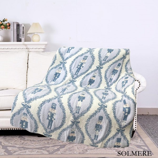 Solmere Blanket – Blue Nutcracker Blanket

Wrap yourself in pure indulgence. Our Solmere Blanket combines a fashion-forward design with an irresistibly soft hand-feel that’s as beautiful as it is cozy.

- Luxuriously Soft – Crafted from ultra-plush, high-quality fibers you’ll want to snuggle into all season long.

- Perfectly Sized – Approximately 50” W x 60” L, perfect for draping over your sofa, bed, or yourself.

- Premium Craftsmanship – 100% polyester for lasting softness, warmth, and easy care.

- Thoughtful Packaging – Each blanket is tied with a branded ribbon in a bow and includes two cards: one featuring the SOLMERE brand and another showcasing a high-quality image of the blanket’s print. Individually packaged

Once you touch it, you’ll understand why SOLMERE blankets are love at first feel.