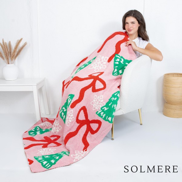 Solmere Blanket – Christmas Tree & Bows Blanket

Wrap yourself in pure indulgence. Our Solmere Blanket combines a fashion-forward design with an irresistibly soft hand-feel that’s as beautiful as it is cozy.

- Luxuriously Soft – Crafted from ultra-plush, high-quality fibers you’ll want to snuggle into all season long.

- Perfectly Sized – Approximately 50” W x 60” L, perfect for draping over your sofa, bed, or yourself.

- Premium Craftsmanship – 100% polyester for lasting softness, warmth, and easy care.

- Thoughtful Packaging – Each blanket is tied with a branded ribbon in a bow and includes two cards: one featuring the SOLMERE brand and another showcasing a high-quality image of the blanket’s print. Individually packaged

Once you touch it, you’ll understand why SOLMERE blankets are love at first feel.
