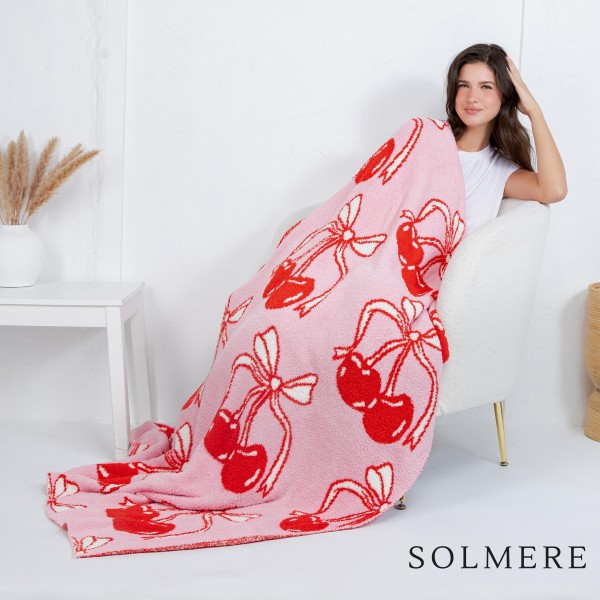Solmere Blanket – Oversized Cherries Blanket

Wrap yourself in pure indulgence. Our Solmere Blanket combines a fashion-forward design with an irresistibly soft hand-feel that’s as beautiful as it is cozy.

- Luxuriously Soft – Crafted from ultra-plush, high-quality fibers you’ll want to snuggle into all season long.

- Perfectly Sized – Approximately 50” W x 60” L, perfect for draping over your sofa, bed, or yourself.

- Premium Craftsmanship – 100% polyester for lasting softness, warmth, and easy care.

- Thoughtful Packaging – Each blanket is tied with a branded ribbon in a bow and includes two cards: one featuring the SOLMERE brand and another showcasing a high-quality image of the blanket’s print. Individually packaged

Once you touch it, you’ll understand why SOLMERE blankets are love at first feel.

