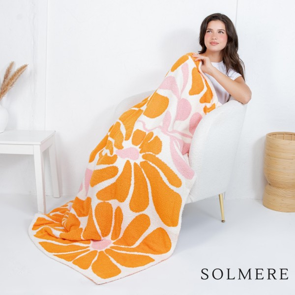 Solmere Blanket – Abstract Floral Print Blanket

Wrap yourself in pure indulgence. Our Solmere Blanket combines a fashion-forward design with an irresistibly soft hand-feel that’s as beautiful as it is cozy.

- Luxuriously Soft – Crafted from ultra-plush, high-quality fibers you’ll want to snuggle into all season long.

- Perfectly Sized – Approximately 50” W x 60” L, perfect for draping over your sofa, bed, or yourself.

- Premium Craftsmanship – 100% polyester for lasting softness, warmth, and easy care.

- Thoughtful Packaging – Each blanket is tied with a branded ribbon in a bow and includes two cards: one featuring the SOLMERE brand and another showcasing a high-quality image of the blanket’s print. Individually packaged

Once you touch it, you’ll understand why SOLMERE blankets are love at first feel.

