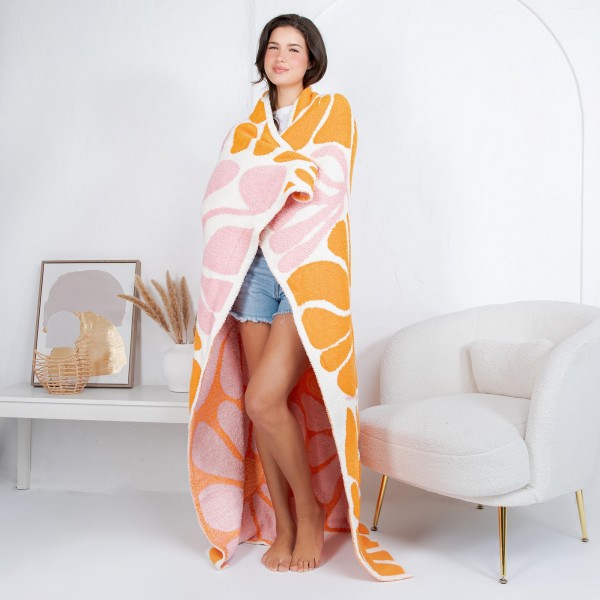 Solmere Blanket – Abstract Floral Print Blanket

Wrap yourself in pure indulgence. Our Solmere Blanket combines a fashion-forward design with an irresistibly soft hand-feel that’s as beautiful as it is cozy.

- Luxuriously Soft – Crafted from ultra-plush, high-quality fibers you’ll want to snuggle into all season long.

- Perfectly Sized – Approximately 50” W x 60” L, perfect for draping over your sofa, bed, or yourself.

- Premium Craftsmanship – 100% polyester for lasting softness, warmth, and easy care.

- Thoughtful Packaging – Each blanket is tied with a branded ribbon in a bow and includes two cards: one featuring the SOLMERE brand and another showcasing a high-quality image of the blanket’s print. Individually packaged

Once you touch it, you’ll understand why SOLMERE blankets are love at first feel.
