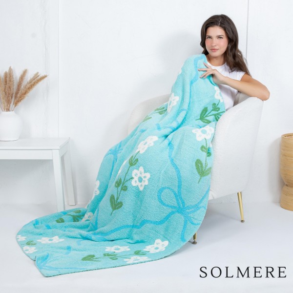 Solmere Blanket – Flowers & Bows Blanket

Wrap yourself in pure indulgence. Our Solmere Blanket combines a fashion-forward design with an irresistibly soft hand-feel that’s as beautiful as it is cozy.

- Luxuriously Soft – Crafted from ultra-plush, high-quality fibers you’ll want to snuggle into all season long.

- Perfectly Sized – Approximately 50” W x 60” L, perfect for draping over your sofa, bed, or yourself.

- Premium Craftsmanship – 100% polyester for lasting softness, warmth, and easy care.

- Thoughtful Packaging – Each blanket is tied with a branded ribbon in a bow and includes two cards: one featuring the SOLMERE brand and another showcasing a high-quality image of the blanket’s print. Individually packaged

Once you touch it, you’ll understand why SOLMERE blankets are love at first feel.
