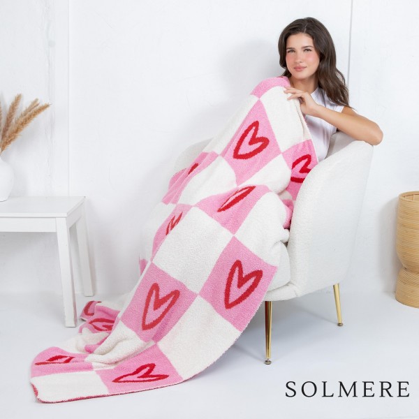 Solmere Blanket – Checkered Hearts Blanket

Wrap yourself in pure indulgence. Our Solmere Blanket combines a fashion-forward design with an irresistibly soft hand-feel that’s as beautiful as it is cozy.

- Luxuriously Soft – Crafted from ultra-plush, high-quality fibers you’ll want to snuggle into all season long.

- Perfectly Sized – Approximately 50” W x 60” L, perfect for draping over your sofa, bed, or yourself.

- Premium Craftsmanship – 100% polyester for lasting softness, warmth, and easy care.

- Thoughtful Packaging – Each blanket is tied with a branded ribbon in a bow and includes two cards: one featuring the SOLMERE brand and another showcasing a high-quality image of the blanket’s print. Individually packaged

Once you touch it, you’ll understand why SOLMERE blankets are love at first feel.
