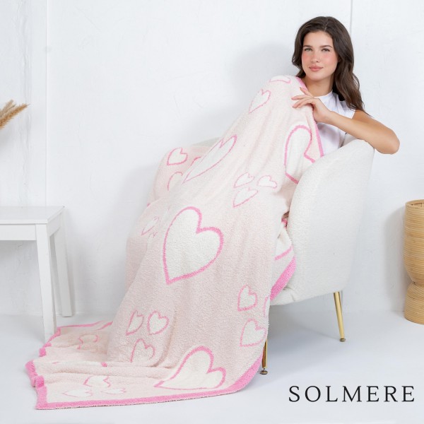Solmere Blanket – Mixed Hearts Blanket

Wrap yourself in pure indulgence. Our Solmere Blanket combines a fashion-forward design with an irresistibly soft hand-feel that’s as beautiful as it is cozy.

- Luxuriously Soft – Crafted from ultra-plush, high-quality fibers you’ll want to snuggle into all season long.

- Perfectly Sized – Approximately 50” W x 60” L, perfect for draping over your sofa, bed, or yourself.

- Premium Craftsmanship – 100% polyester for lasting softness, warmth, and easy care.

- Thoughtful Packaging – Each blanket is tied with a branded ribbon in a bow and includes two cards: one featuring the SOLMERE brand and another showcasing a high-quality image of the blanket’s print. Individually packaged

Once you touch it, you’ll understand why SOLMERE blankets are love at first feel.
