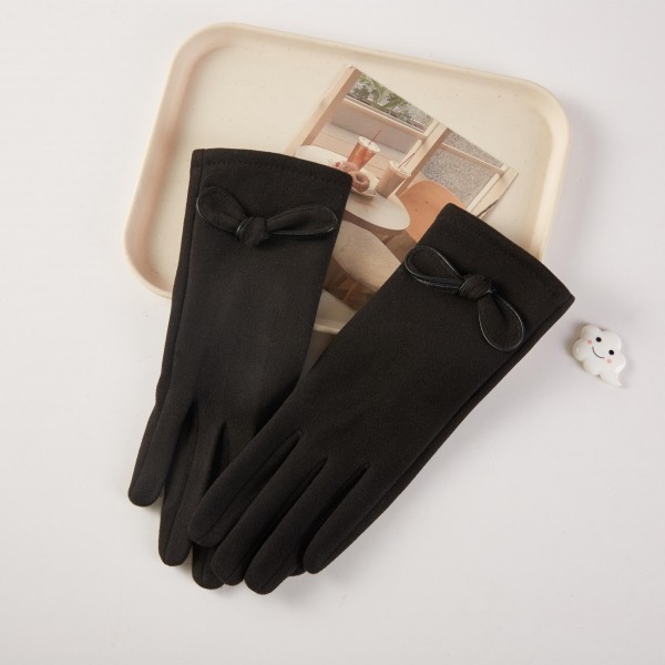 Soft Knit Gloves Featuring Bow Accent 

- One Size Fits 
- 100% Polyester 