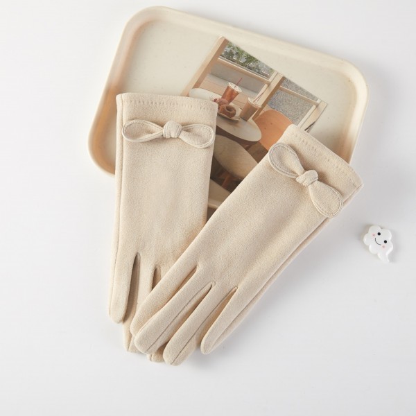 Soft Knit Gloves Featuring Bow Accent 

- One Size Fits 
- 100% Polyester 