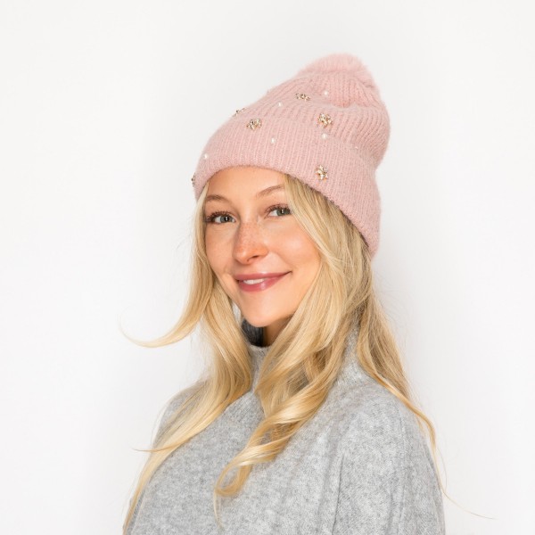 Fuzzy Knit Beanie With Faux Fur Pom, Pearls, & Rhinestone Flower Details 

- One Size Fits Most 
- 100% Polyester 