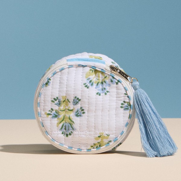 Floral Print Circular Quilt Pouch With Tassel 

- Full Zip Closure 
- 1 Internal Open Pocket 
- Stripe Print Inside 
- Approximately 4" T X 4" L X 1.75" D
