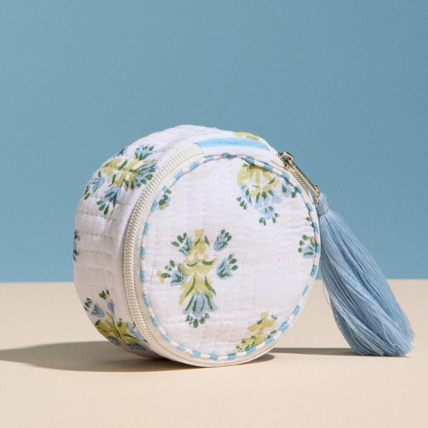 Floral Print Circular Quilt Pouch With Tassel 

- Full Zip Closure 
- 1 Internal Open Pocket 
- Stripe Print Inside 
- Approximately 4" T X 4" L X 1.75" D