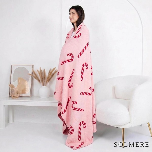 Solmere Blanket – Candy Cane Blanket

Wrap yourself in pure indulgence. Our Solmere Blanket combines a fashion-forward design with an irresistibly soft hand-feel that’s as beautiful as it is cozy.

- Luxuriously Soft – Crafted from ultra-plush, high-quality fibers you’ll want to snuggle into all season long.

- Perfectly Sized – Approximately 50” W x 60” L, perfect for draping over your sofa, bed, or yourself.

- Premium Craftsmanship – 100% polyester for lasting softness, warmth, and easy care.

- Thoughtful Packaging – Each blanket is tied with a branded ribbon in a bow and includes two cards: one featuring the SOLMERE brand and another showcasing a high-quality image of the blanket’s print. Individually packaged

Once you touch it, you’ll understand why SOLMERE blankets are love at first feel.
