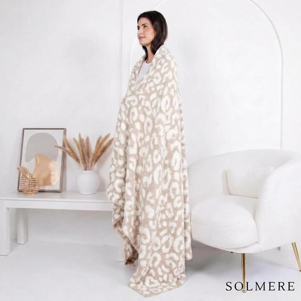 Solmere Blanket – Beige Leopard Print Blanket

Wrap yourself in pure indulgence. Our Solmere Blanket combines a fashion-forward design with an irresistibly soft hand-feel that’s as beautiful as it is cozy.

- Luxuriously Soft – Crafted from ultra-plush, high-quality fibers you’ll want to snuggle into all season long.

- Perfectly Sized – Approximately 50” W x 60” L, perfect for draping over your sofa, bed, or yourself.

- Premium Craftsmanship – 100% polyester for lasting softness, warmth, and easy care.

- Thoughtful Packaging – Each blanket is tied with a branded ribbon in a bow and includes two cards: one featuring the SOLMERE brand and another showcasing a high-quality image of the blanket’s print. Individually packaged

Once you touch it, you’ll understand why SOLMERE blankets are love at first feel.