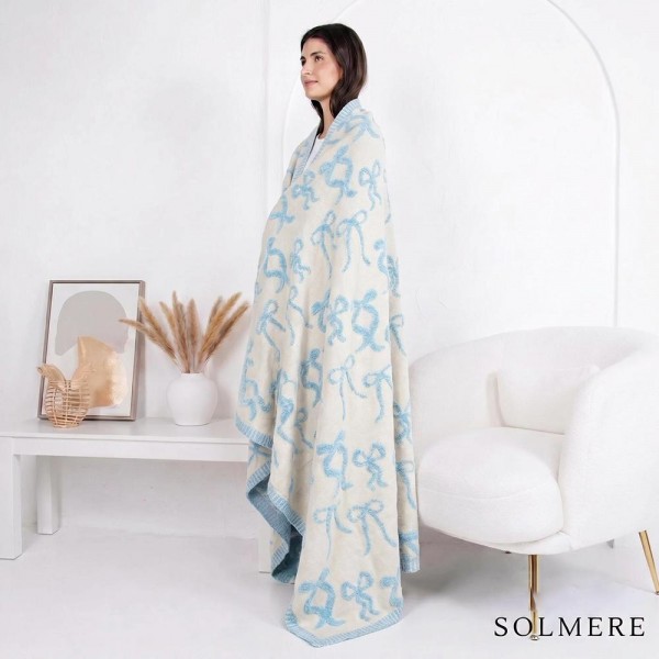 Solmere Blanket – Bow Blanket

Wrap yourself in pure indulgence. Our Solmere Blanket combines a fashion-forward design with an irresistibly soft hand-feel that’s as beautiful as it is cozy.

- Luxuriously Soft – Crafted from ultra-plush, high-quality fibers you’ll want to snuggle into all season long.

- Perfectly Sized – Approximately 50” W x 60” L, perfect for draping over your sofa, bed, or yourself.

- Premium Craftsmanship – 100% polyester for lasting softness, warmth, and easy care.

- Thoughtful Packaging – Each blanket is tied with a branded ribbon in a bow and includes two cards: one featuring the SOLMERE brand and another showcasing a high-quality image of the blanket’s print. Individually packaged

Once you touch it, you’ll understand why SOLMERE blankets are love at first feel.